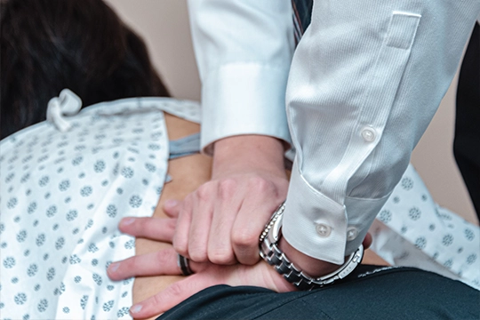 Dr. Hyunjae Lee performing a chiropractic adjustment in Clifton, NJ