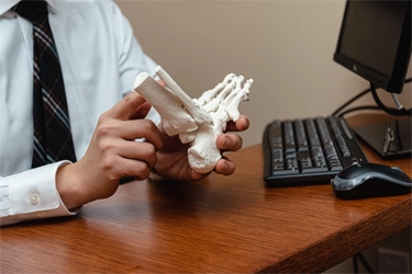 Pain Relief Clifton NJ Hyunjae Lee With Foot Bone